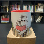 Gatos leyendo sobre libros